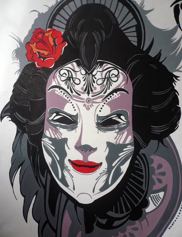 Detail of the geisha's face with red lips