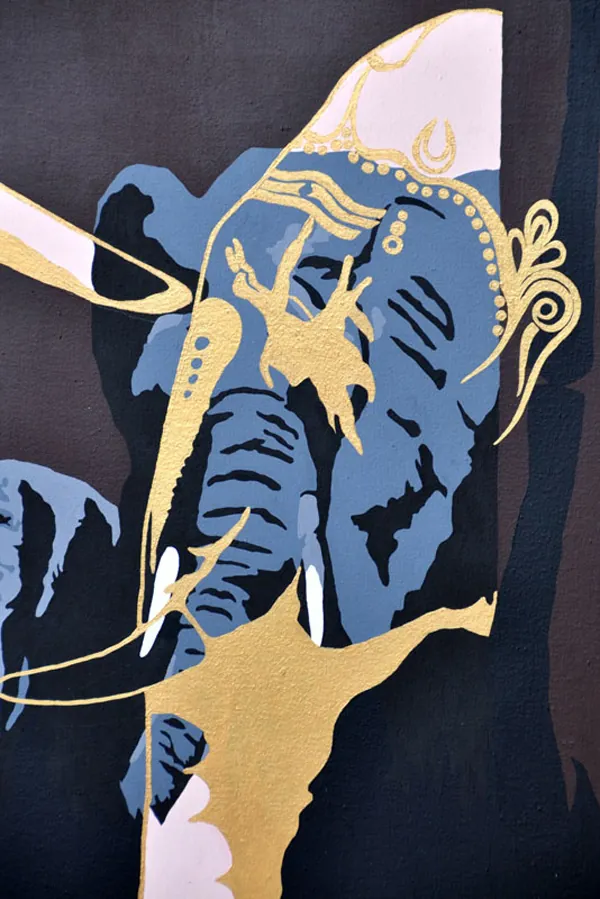 Detail of an elephant's head painted with gold ornaments