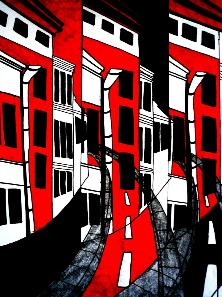 Red and black apartment buildings leaning over a road