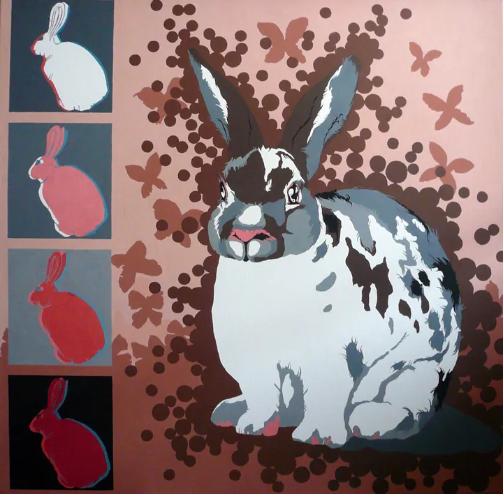 Spotted rabbit with brown dots and butterflies beside four small coloured rabbits