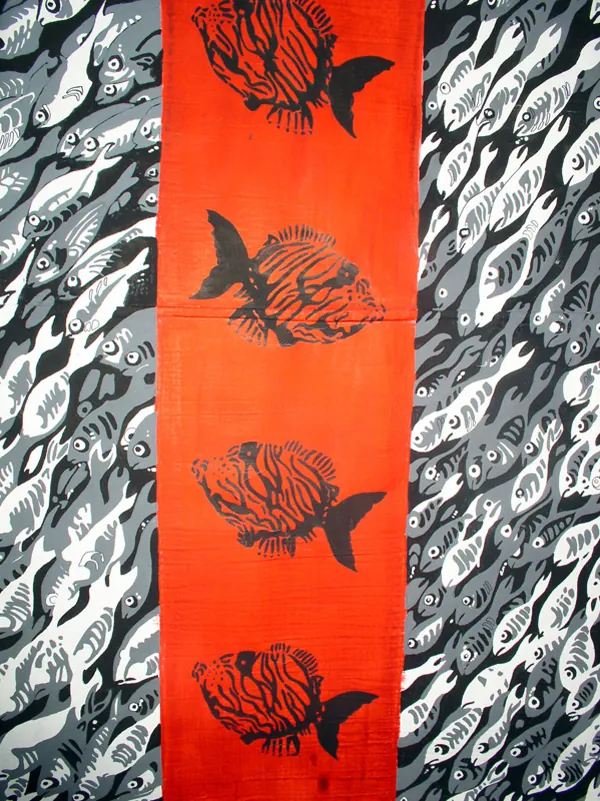 Detail of a red band with black fish