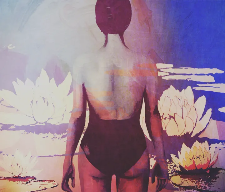 A woman in a swimsuit from behind among water lilies in violet light