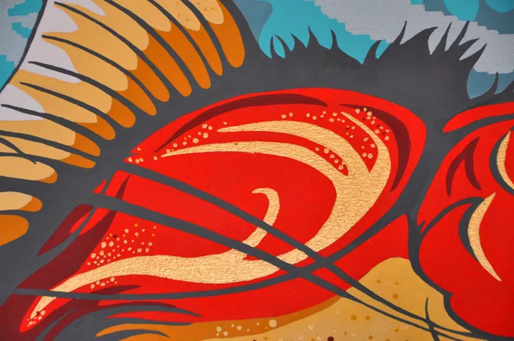 Detail of the red-and-gold fish's body and fins