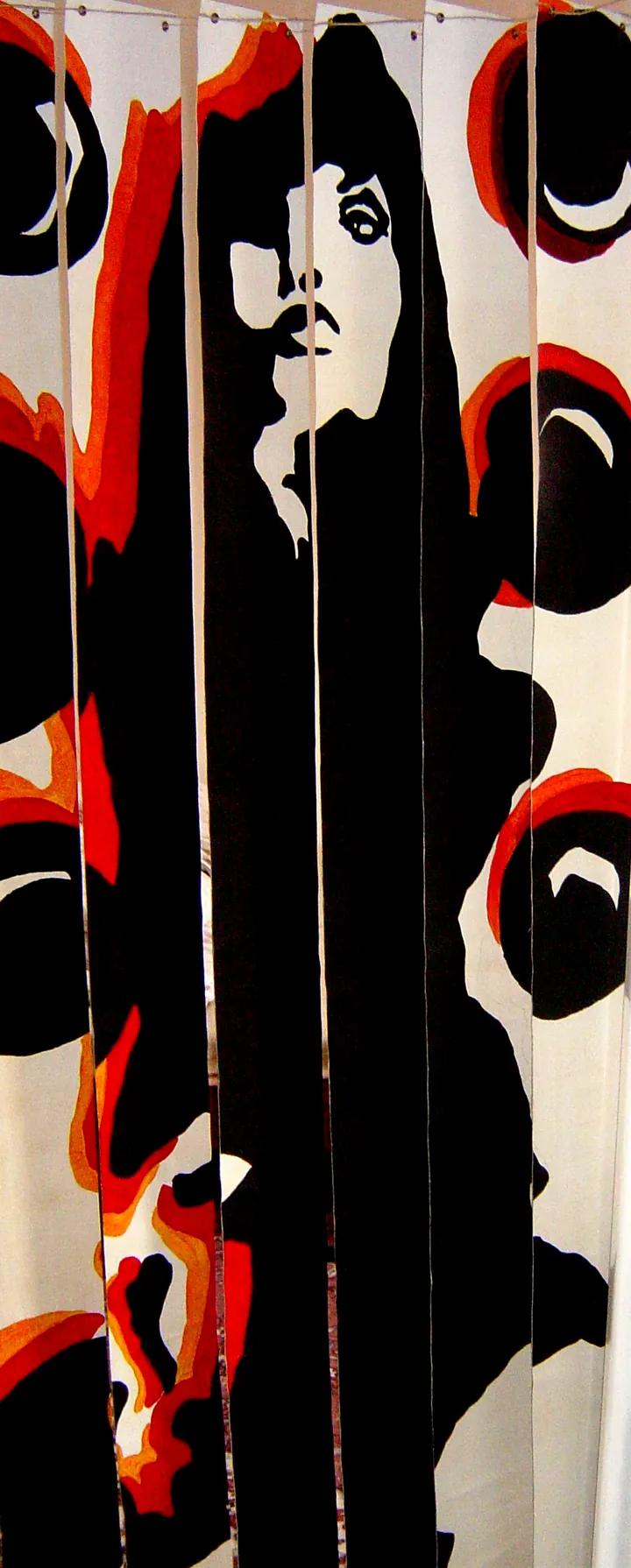 Roller blind painted with a woman's face in black, red and white